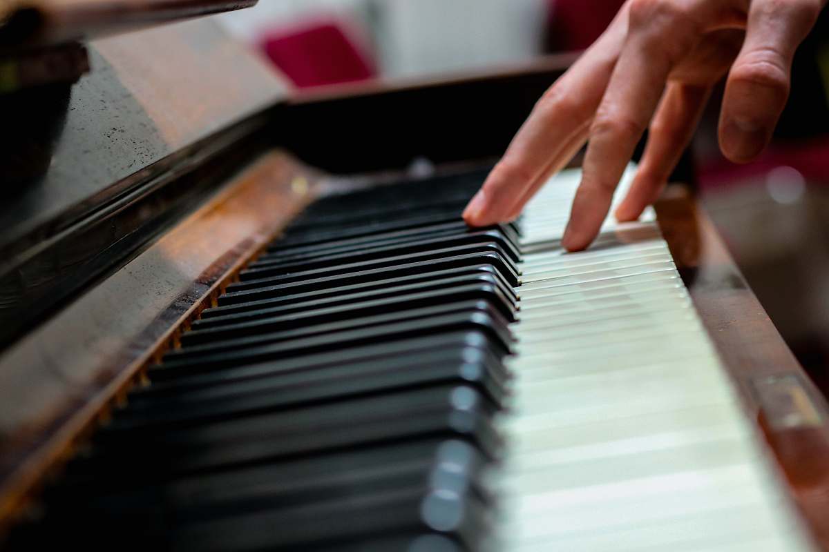 musical instrument person playing black and white piano leisure activities